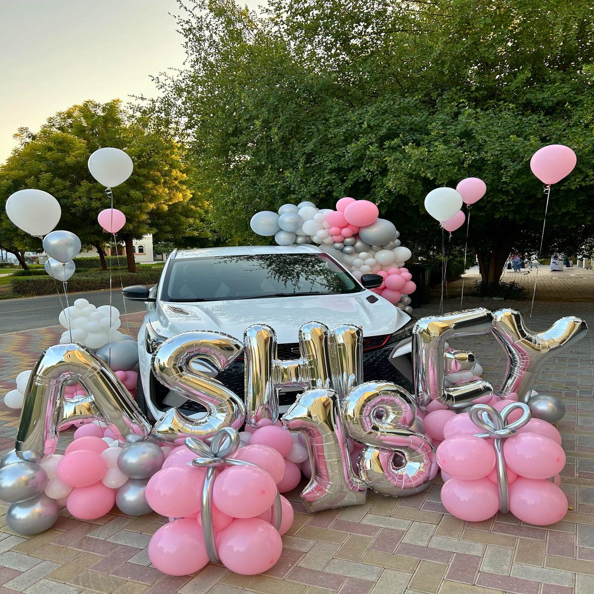 Car Surprise Balloon Design in Pink, White, and Silver  Perfect for Any Memorable Celebrations